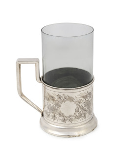 A Russian silver tea glass holder with insert, St. Petersburg, circa 1885, the holder 9.5cm high, 11cm wide, 118 grams, 13.5cm high overall