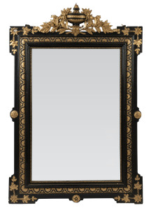 An antique French pier mirror in ebonized and gilt frame, 19th century, ​125 x 82cm