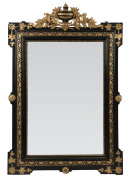 An antique French pier mirror in ebonized and gilt frame, 19th century, ​125 x 82cm