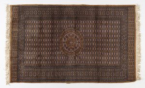 A Turkomen pink and gold coloured hand-knotted rug, 20th century, ​160 x 93cm