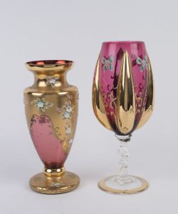 An Italian ruby glass goblet and vase, both with enamel floral decoration and gilded highlights, mid 20th century, (2 items), 34cm and 30cm high