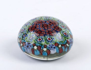 A millefiori glass paperweight, 20th century, ​4.5cm high, 8cm diameter