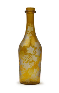 An English Regency wine decanter, amber glass finely decorated with wheel engraved grape motif, circa 1820, 28cm high