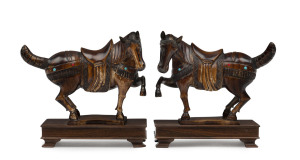 A pair of Chinese carved ivory horse statues, patinated finish studded with turquoise and coral, 19th/20th century, 15cm high, 16cm long