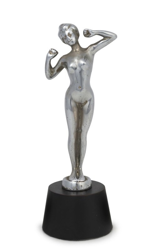 A chrome plated standing female nude car mascot on later wooden plinth, circa 1930, ​20.5cm high overall