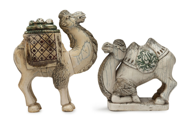 A pair of Chinese carved ivory camel statues with hand coloured finish, late 19th early 20th century, the larger 16cm high, 13.5cm long