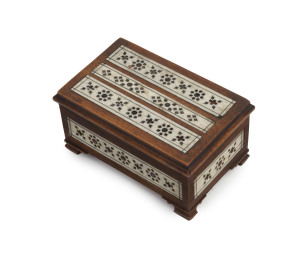 An Anglo-Indian letter game comprising numerous carved bone letters in a timber and bone box studded with natural rubies, 19th century, the box 5cm high, 10cm wide, 6.5cm deep