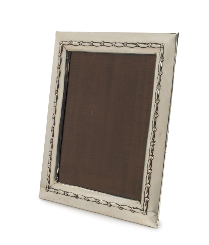 An English sterling silver framed table picture frame, Birmingham, circa 1907, ​26cm high, 21cm wide