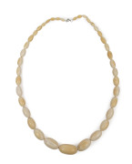 An antique ivory graduated oval bead necklace, 19th century, 74cm long