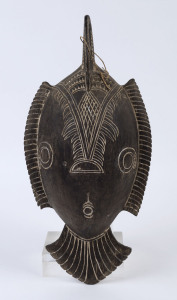 A food bowl, carved wood and piped clay, Huon Gulf, Papua New Guinea, 20th century, ​50cm wide