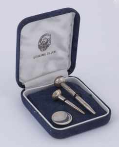 A sterling silver boxed golfing set, 20th century, stamped "925" with pictorial maker's marks, the larger tee 6.5cm high