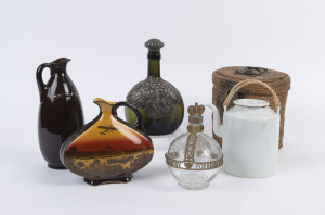 Four assorted decanters and a Chinese blanc de chine teapot in basket, 19th and 20th century, (5 items), ​the largest 24cm high