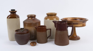 Assorted stoneware and pottery jars, jugs and bed warmer together with an Australian timber compote and a Tasmanian napkin ring, 19th and early 20th century, (8 items), ​the largest 29cm high
