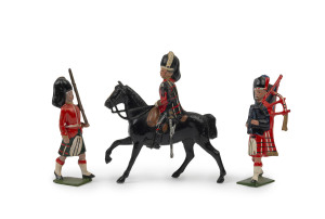 BRITAINS: - 54mm Hollow Cast Lead - Highlanders: group of figures including Mounted Officer & Bagpipers (2); most of the figures with an articulated rifle carrying arm. (21)