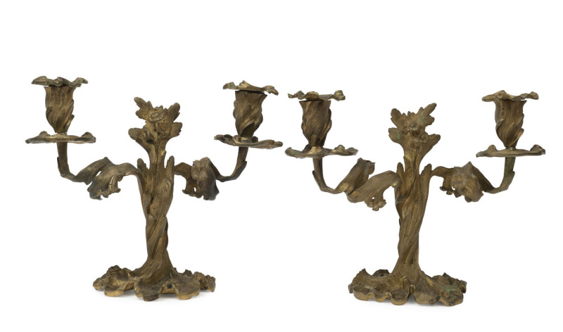 A pair of French bronze two branch candelabra, mid 19th century, ​24cm high, 29cm wide