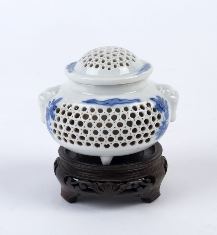 A Chinese reticulated porcelain lidded vase on later timber stand, 19th/20th century, ​10.5cm high overall