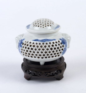 A Chinese reticulated porcelain lidded vase on later timber stand, 19th/20th century, 10.5cm high overall