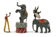 BRITAINS: - Hollow Cast Lead - Circus Figures: c.1950s group including Elephants (3), Tiger, Boxing Kangaroo (with gloves), Clowns (3) two with boxing gloves, circus horses (7) and female horse acrobat, "Tall Man" (height 9cm), Ringmaster, etc; few figure