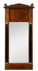 A Biedermeier Empire style pier mirror, mahogany with ormolu mounts and ebonised half columns, circa 1820, ​168 cm high, 80cm wide