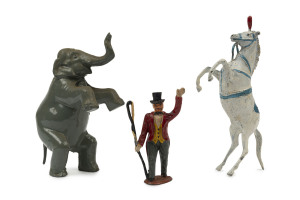 BRITAINS: - Hollow Cast Lead - Circus Figures: including Elephants (3), Tiger, Boxing Kangaroo (with gloves), Clowns (2) one with boxing gloves, circus horses (7), acrobats (2), ballerina, "Tall Man" (height 9cm), Ringmaster, etc; a few figures with artic