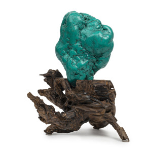 A Mongolian natural turquoise mineral specimen on timber stand, the specimen 22cm high, 16cm wide, 10cm deep