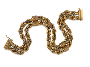 A 10ct yellow and white gold double rope twist bracelet, marks rubbed but tests as 10ct or better, ​19cm long, 22.5 grams