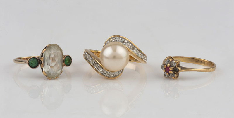 Three assorted gold rings set with stones including diamonds, emeralds and pearl, ​9.2 grams total