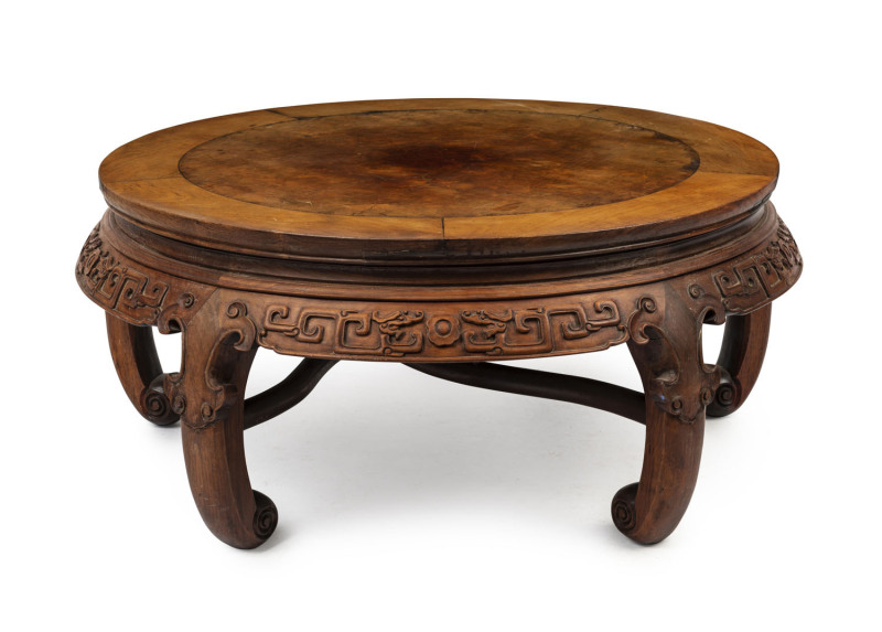 A Chinese circular coffee table, carved rosewood with burr elm top, early 20th century, 35cm high, 83cm diameter