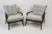 A pair of timber framed armchairs with blue upholstered cushions, early to mid 20th century, 72cm high, 64cm across the arms