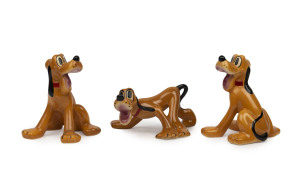 PLUTO: painted and glazed ceramic figurines (3, two identical) by Shaw/American Pottery, c.1940s, tallest 13cm, widest 17cm.