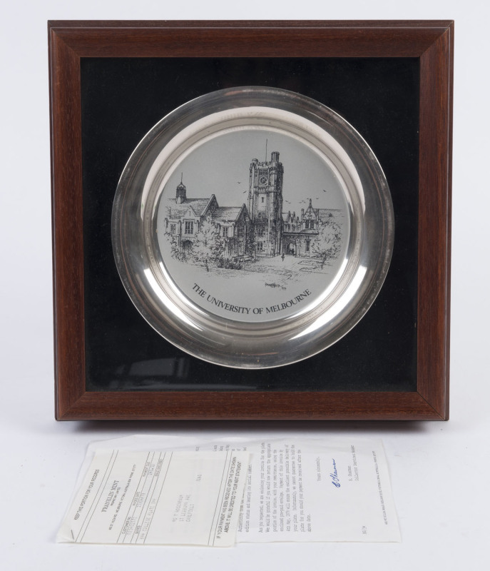 A sterling silver commemorative plate "The University of Melbourne" designed by Kenneth Jack for Franklin Mint, 1979, framed and mounted, ​the plate 20cm diameter