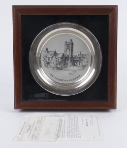 A sterling silver commemorative plate "The University of Melbourne" designed by Kenneth Jack for Franklin Mint, 1979, framed and mounted, the plate 20cm diameter