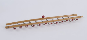 A vintage Italian folding tie rack, stamped "Brevette Reguitti", 44cm wide