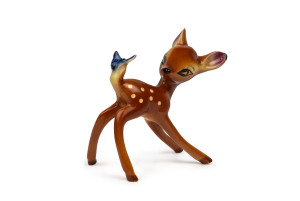 BAMBI: painted and glazed ceramic figurine of "Bambi Looking at Blue Butterfly on Tail", no markings, likely Japanese, c.1940s, height 17cm.