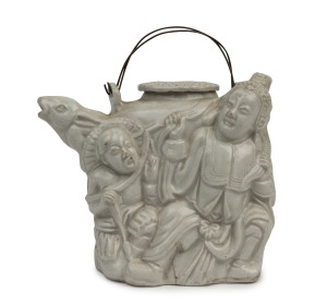 A Chinese blanc de chine figural teapot, Ming Dynasty, 11.5cm high, 13.5cm wide