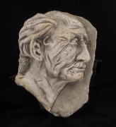 A plaster relief bust portrait in profile, 19th century, 33cm high, 23cm wide
