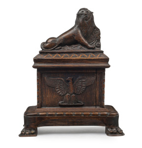 An English oak carving of a lion mounted on a sarcophagus with claw feet, 16th/17th century, 45cm high