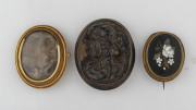 Three antique brooches including pietra dura, oval mourning and bog oak cameo, 19th century, the largest 5cm high