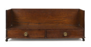 A Georgian oak tabletop book stand with two drawers, original brass handles and castors, circa 1800, ​28cm high, 71cm wide, 23cm deep