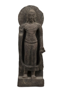 An antique Thai standing Buddha, carved stone, 17th/18th century, ​62cm high