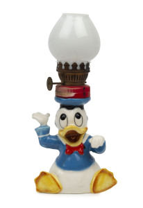 DONALD DUCK: ceramic figurine lamp holder, stamped 'Crown/Disney/Lamp/Japan' on base with adjacent "Butterfly Brands" label; c.1930s, height 18cm.