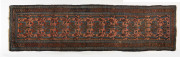 A vintage hand-woven tribal runner rug, early 20th century, 296 x 82cm