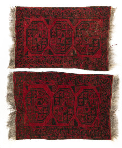 Two hand-woven red and black patterned tribal mats, 20th century, 104 x 63cm each