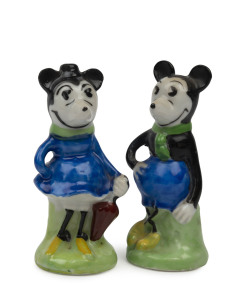 MICKEY & MINNIE MOUSE: painted and glazed group comprising ceramic scent bottle (no stopper), made in Japan; glass scent bottle mounted on original green bakelite stand and two small ceramic Mickey & Minnie salt & pepper shakers; c.1930s-50s; tallest 11cm