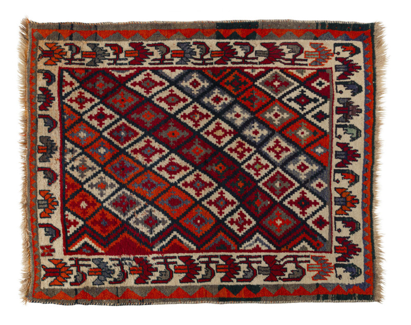 A hand-woven tribal rug with bold orange colours, 20th century, 155 x 125cm