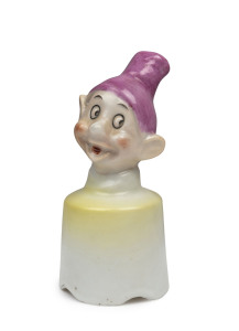 SNOW WHITE AND SEVEN DWARFS: Rare "Dopey" ceramic pie vent funnel; Australian, c.1930s, height 11cm.