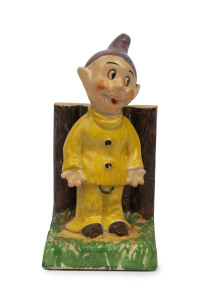 SNOW WHITE AND SEVEN DWARFS: Trio of ceramic items comprising "Bashful" playing violin figural vase, "Sleepy" figurine and "Dopey" standing again wooden fence figural piece; c.1940s, tallest 18cm. (3)