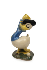 DONALD DUCK: brightly painted and glazed ceramic figurine of Donald Duck playing golf (missing golf club), unmarked but likely Italian, possibly by Zaccagnini Ceramics; c.1940s, height 21cm, width (at base) 13cm.