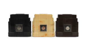 Three A.W.A. "Empire State" cigarette cases, ​8cm high