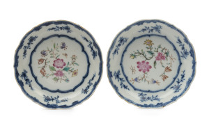 A pair of Chinese porcelain dishes with enamel floral decoration and underglaze blue borders, 18th century, 12cm diameter